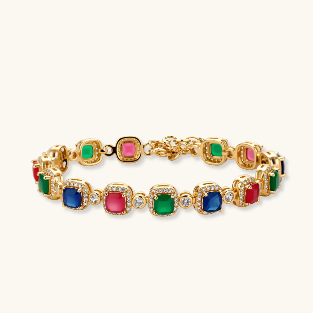 Gold-plated jewelry set with red, green, and blue cubic zirconia stones including necklace, bracelet, and drop earrings.
