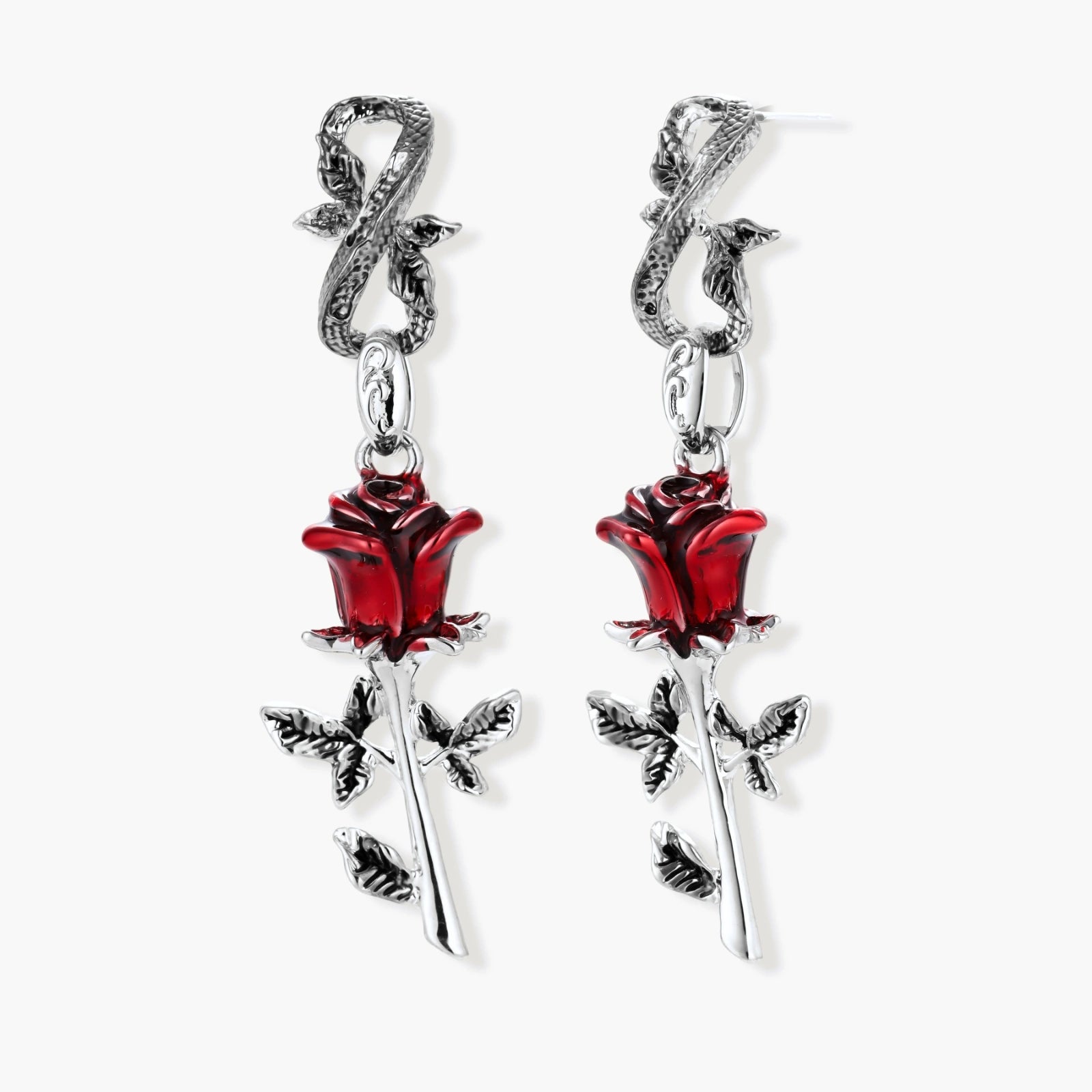 Gothic dangle earrings featuring silver serpent hooks with red enamel roses and metallic stems on white background.