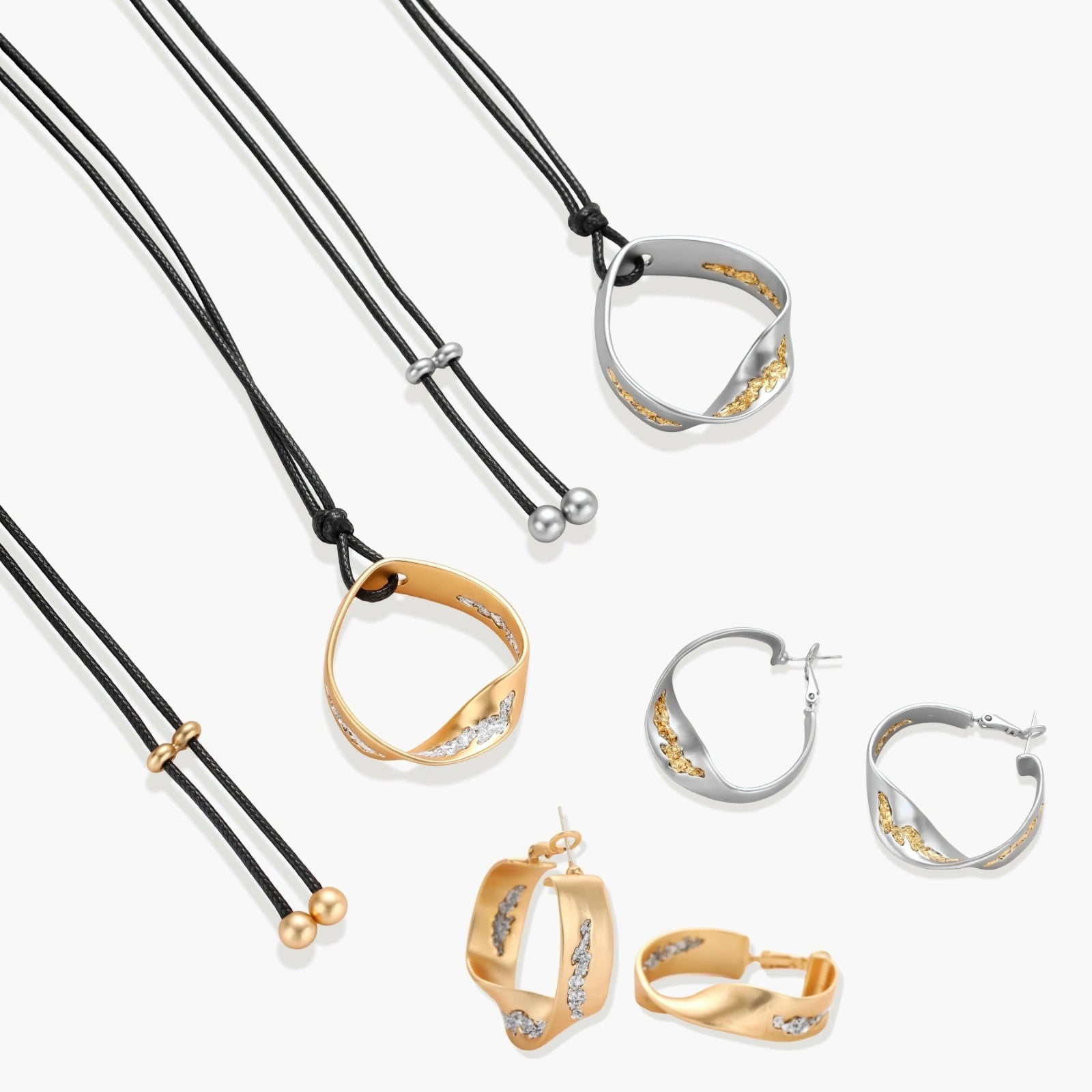 Artistic jewelry set featuring curved silver pendant with gold veining on black cord plus matching asymmetrical hoop earrings