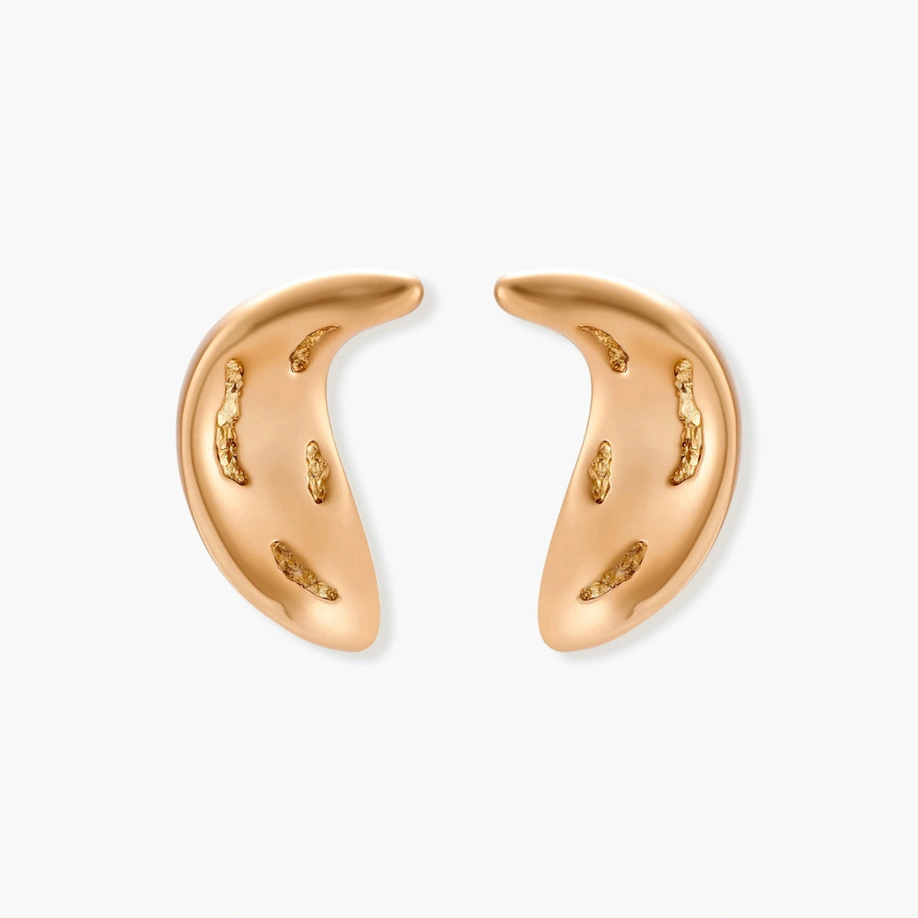 Gold-toned crescent moon pendant with textured surface on black adjustable cord, displayed with matching crescent earrings