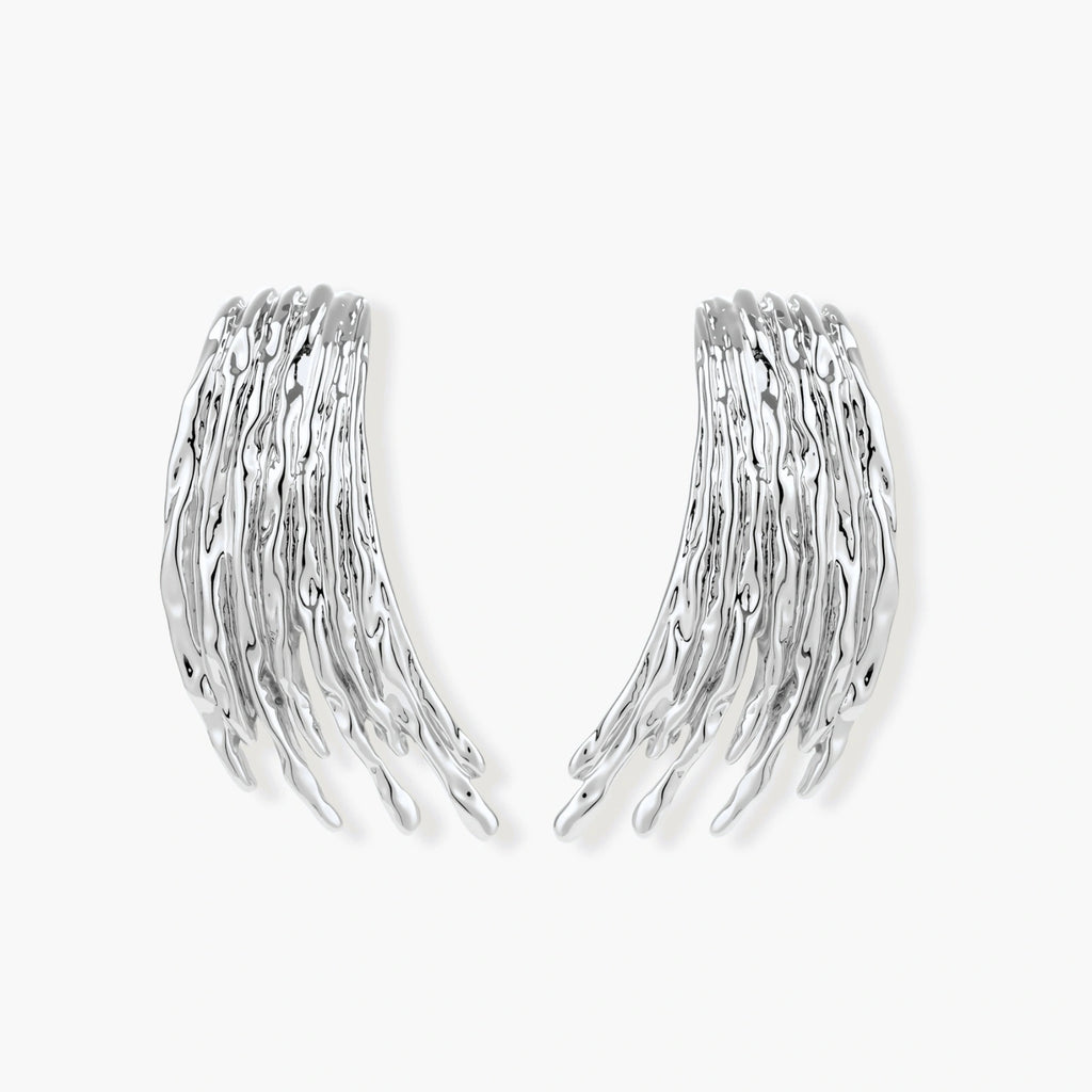 Layered metallic wing-shaped pendant and matching earrings with feathered texture in silver and gold finishes