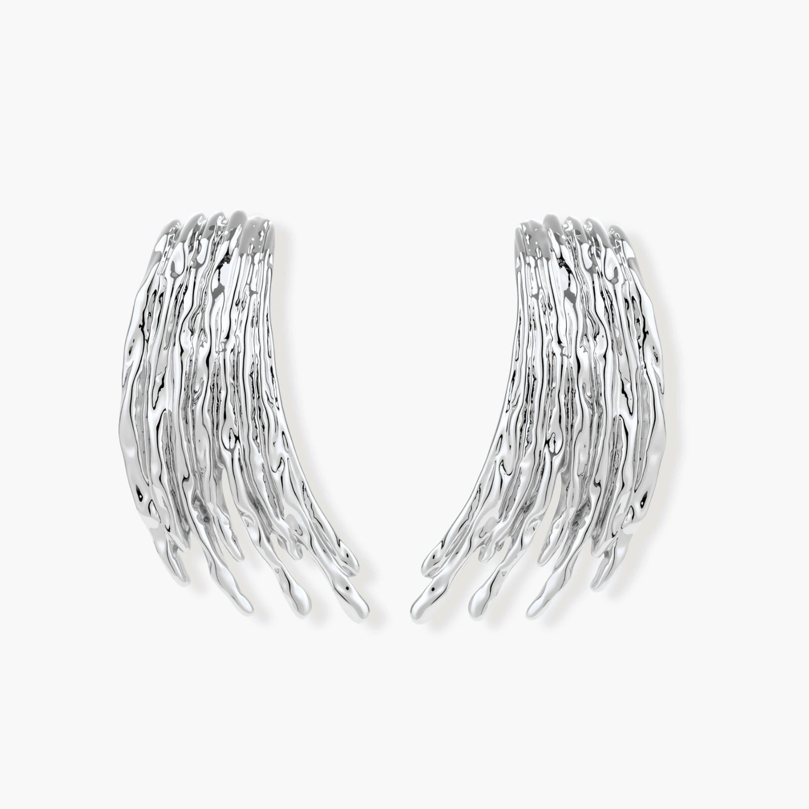 Layered metallic wing-shaped pendant and matching earrings with feathered texture in silver and gold finishes