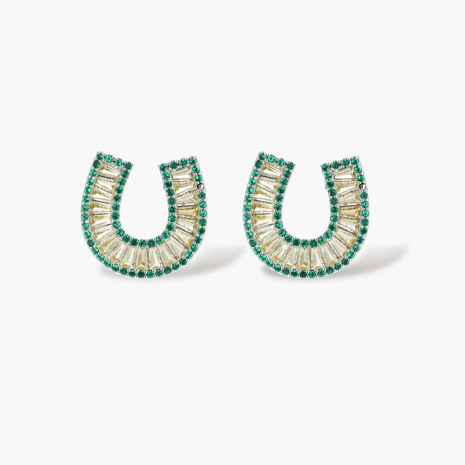 Geometric horseshoe-shaped jewelry set with radiating white zirconia center and jade-green border stones on white background.