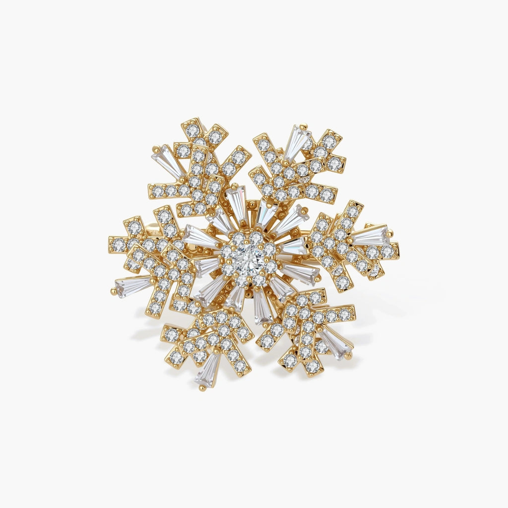 Geometric snowflake brooch with 14K gold-plated copper setting and clear zirconia crystals arranged in radiating pattern.