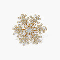 Geometric snowflake brooch with 14K gold-plated copper setting and clear zirconia crystals arranged in radiating pattern.