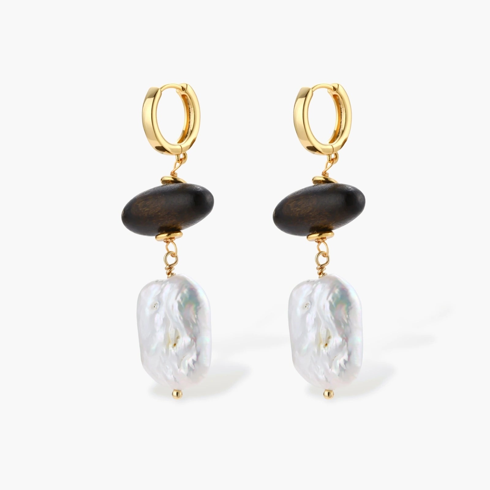 Gold hoop earrings with dark wood beads and baroque freshwater pearls, shown from multiple angles on cream background.